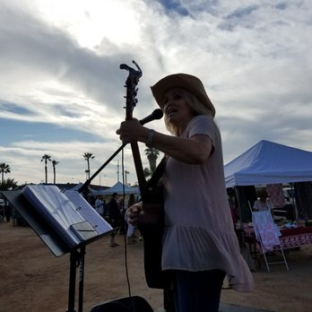 The Market at North Beach - a woman playing a guitar - Farmers Market Near Me - San Clemente, California The Market at North Beach - a woman playing a guitar - Farmers Market Near Me - San Clemente, California