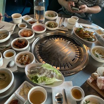 Piggy's Island - All the side dishes crowded at a table - Korean Near Me - Thornhill, Ontario