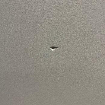 Macy's Furniture Gallery - hole in the newly painted wall behind new sofa - Furniture Stores Near Me - Framingham, Massachusetts Macy's Furniture Gallery - hole in the newly painted wall behind new sofa - Furniture Stores Near Me - Framingham, Massachusetts