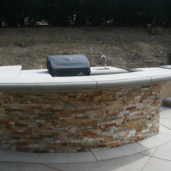 MKD Landscaping - an outdoor kitchen with a grill - Landscaping Near Me - Santa Ana, California
