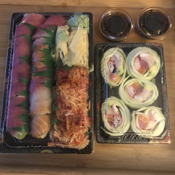 Sushi Weng - The larger container is approx 8-9" x 4" & the white stuff in the upper right corner is ginger & wasabi. - Sushi Bars Near Me - Waterford Charter Township, Michigan