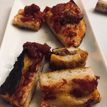 Signorvinomtl - a plate of food on a table - Wine Bars Near Me - Montreal, Quebec