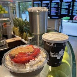 a bowl of fruit and a cup of coffee