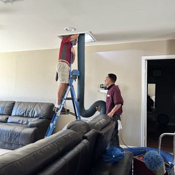 Duct Pros - Jackson and Mario cleaning out the main register. - Air Duct Cleaning Near Me