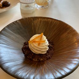 Mascarpone ice cream, candied orange peel over chocolate biscuit shavings