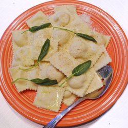 Garofalo's Calabria - Pumpkin Ravioli Homemade Roasted Squash Ravioli's dressed with sage butter sauce, and garnished lightly with Perocino Cheese