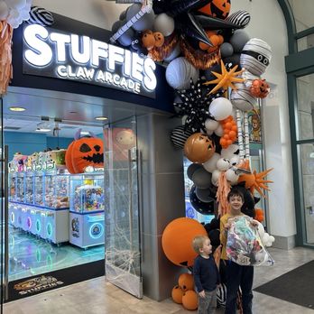 Stuffies Claw Arcade - Decorated entrance to the shop and my kids with their stuffies. - Arcades Near Me - Salinas, California