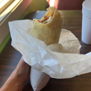 Raliberto's Taco Shop - a hand holding a burrito - Tacos Near Me - Weaverville, California Raliberto's Taco Shop - a hand holding a burrito - Tacos Near Me - Weaverville, California
