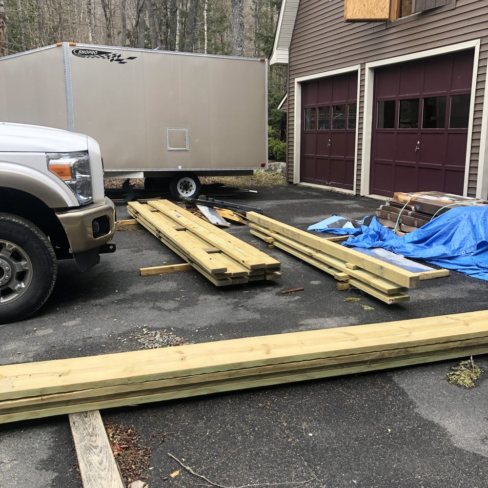 Northeast Building Services - a truck parked in front of a house - Roofing Near Me - Lincoln, Maine Northeast Building Services - a truck parked in front of a house - Roofing Near Me - Lincoln, Maine