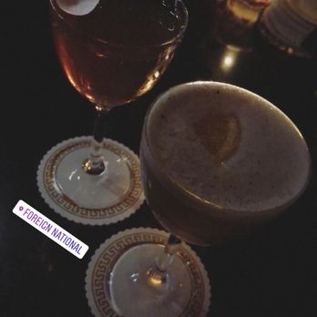 Foreign National - One of their speciality cocktails and a bartenders choice - Cocktail Bars Near Me - Seattle, Washington
