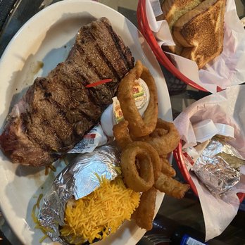 Pete's Place - Pete 's Ribeye, onion rings, and baked potato - Pubs Near Me - Maynardville, Tennessee