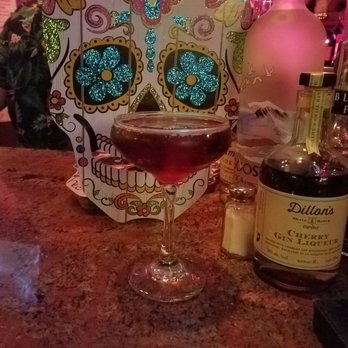 Dito's Bar - a glass of wine and a sugar skull - Cocktail Bars Near Me - Washington, DC, District of Columbia