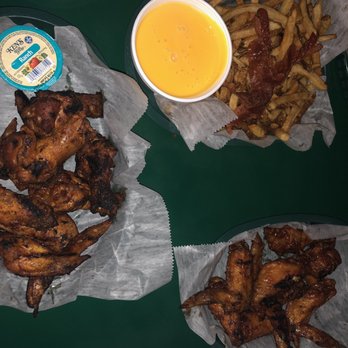 Hammocks Grill - Grill wings on the left, Bbq wings on the right, cheese fries add bacon. - Sports Bars Near Me - The Hammocks, Florida