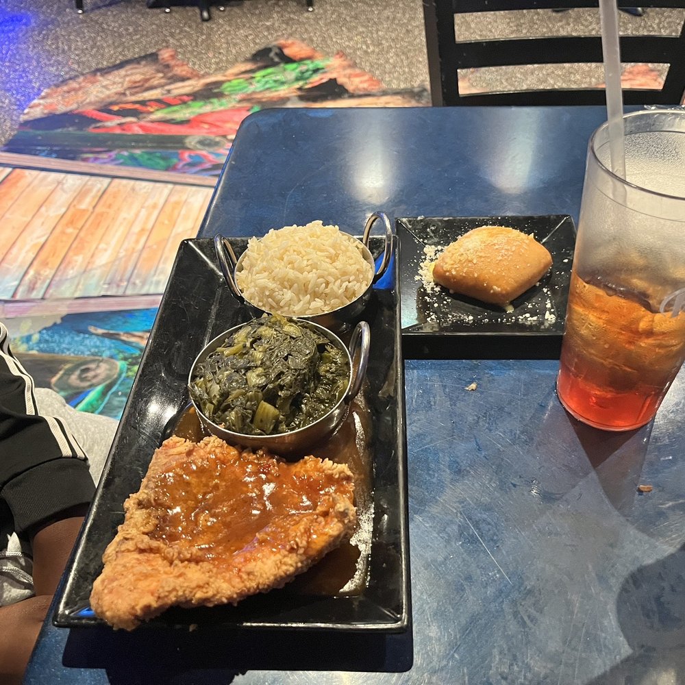 Godfreys - Fried salmon with greens and rice - Caribbean Near Me - Flowood, Mississippi Godfreys - Fried salmon with greens and rice - Caribbean Near Me - Flowood, Mississippi
