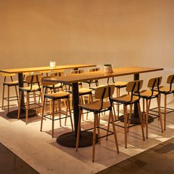 Affordable Seating - Slate metal bar stools in black finish with walnut wood seats and back (#947-BS-BF). Also featuring solid wood tables (#SWPL)