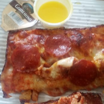 Jet's Pizza - Pepperoni slice with garlic sauce on the side - Pizza Near Me - St. Joseph, Michigan