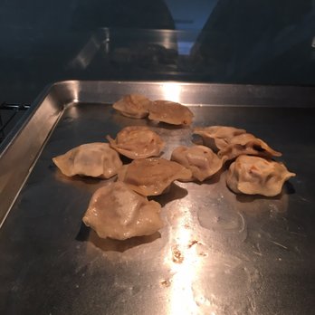 So Inviting - a pan of dumplings cooking in the oven - Chinese Near Me - London, Ontario So Inviting - a pan of dumplings cooking in the oven - Chinese Near Me - London, Ontario