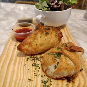 Empanola - Beef empanadas and crawfish empanadas, with side of salad. Crawfish was my fav! - Empanadas Near Me - New Orleans, Louisiana