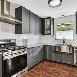 DFW Granite - Beautiful Bianco Primata Granite Custom Kitchen Countertops and White Ceramic Tile Backsplash.  Plano TX 75075 visit dfwgranite.com