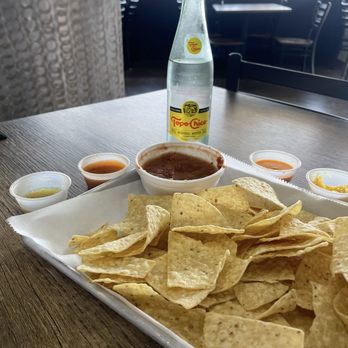 Tacusa - Chips and salsa with smaller cups from the salsa/condiment bar - Tacos Near Me - Hurst, Texas