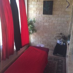 Massage By Heather - Relax and unwind on a breezy patio with the sound of birds and the wind rustling in the palms.