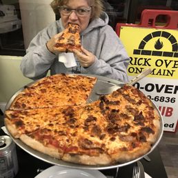 Helen Enjoying her First Bite of Brick Oven on Main In Bridgeport, CT