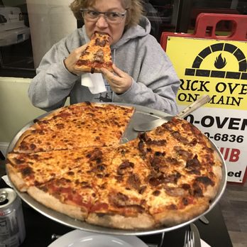 Brick Oven On Main - Helen Enjoying her First Bite of Brick Oven on Main In Bridgeport, CT - Pizza Near Me - Bridgeport, Connecticut