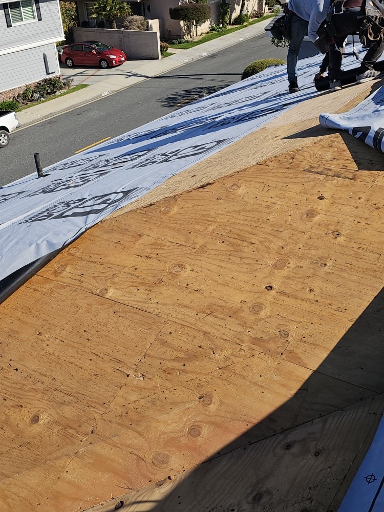 Slide of Juniors Roofing