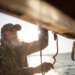 Real Good Fish - Stan securing the outriggers for fishing