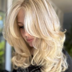 Ember Salon - Added many layers for movement, to be worn curly or straight. Blonde highlights.