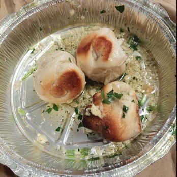 Marcelino's Pizzeria & Restaurant - Garlic knots with garlic sauce and chunks of garlic and baisley - Pizza Near Me - New Windsor, New York Marcelino's Pizzeria & Restaurant - Garlic knots with garlic sauce and chunks of garlic and baisley - Pizza Near Me - New Windsor, New York