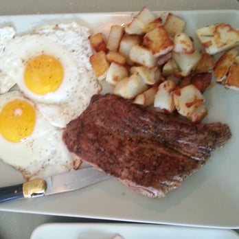 The Strand - Medium-rare steak, home fries, and sunny side up eggs. It cooked to perfection, just how I asked for it. - New American Near Me - Orlando, Florida The Strand - Medium-rare steak, home fries, and sunny side up eggs. It cooked to perfection, just how I asked for it. - New American Near Me - Orlando, Florida