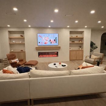 LogiBuilt - Custom Media Wall buildout with cabinets, shelving, electric fireplace, mantle, and Frame TV mounting - Home Automation Near Me - Carrollwood, Florida LogiBuilt - Custom Media Wall buildout with cabinets, shelving, electric fireplace, mantle, and Frame TV mounting - Home Automation Near Me - Carrollwood, Florida