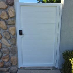 OC Local Garage Door & Gate - New metal frame and horizontal composite wood pedestrian gate in Santa Ana by Oc Local Garage Doors And Gates