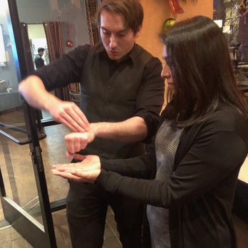 Apollo Magic - Bryan of Apollo Magic performing at our holiday party! - Magicians Near Me