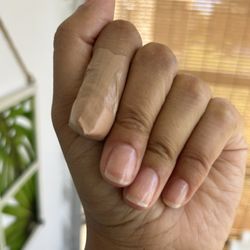 Tina’s Beauty Atelier - Clear coat regular manicure. She showed my damaged nail extra love by applying an antibiotic cream & bandaging it