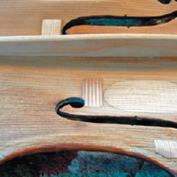 Atlanta Violins - A completed soundpost patch and new bassbar on an antique restoration.