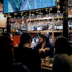 Sake Noire - Owner behind the back bar