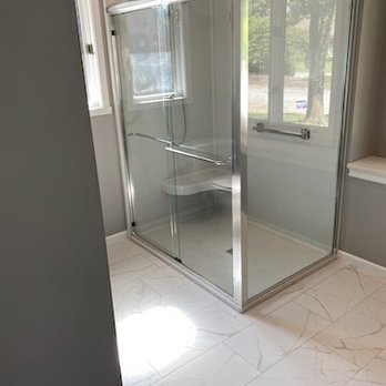 House Guys - a bathroom with a glass shower - General Contractors Near Me House Guys - a bathroom with a glass shower - General Contractors Near Me