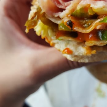 Subway - a person's hand holding a sandwich - Sandwiches Near Me - Edmonton, Alberta Subway - a person's hand holding a sandwich - Sandwiches Near Me - Edmonton, Alberta