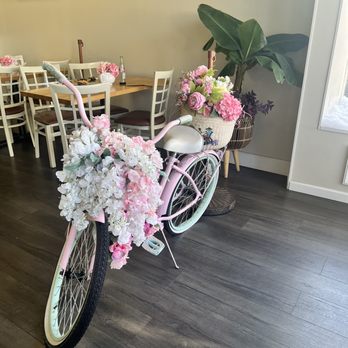 Angie's Café & Bakery - a pink bicycle decorated with flowers - Bakeries Near Me - Metuchen, New Jersey
