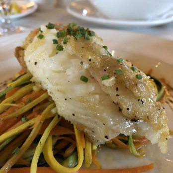 Eddie Merlot's - Pan-Roasted Sea Bass on julienne veggies. - Steakhouses Near Me - Fort Wayne, Indiana