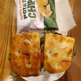 Toasted Caprese Focaccia with chips. Toasted Caprese Focaccia with chips.