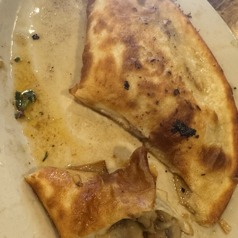 Greasy quesadilla. They cook the tortillas in too much butter and it makes the meal greasy