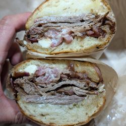 The conn - mulberry's own bbq tri-tip doused in virginia's blue cheese dressing, caramelized red onions on sourdough roll
