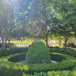 Sculpted gardens accented by art pieces. Sculpted gardens accented by art pieces.