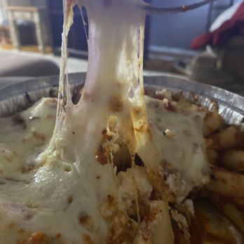 Gus's Pizzeria - melted cheese on a fork - Pizza Near Me - Pennsville, New Jersey Gus's Pizzeria - melted cheese on a fork - Pizza Near Me - Pennsville, New Jersey