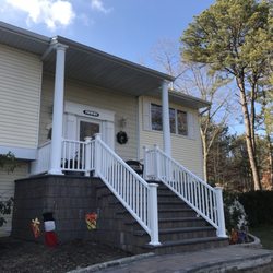 New Horizon Homes - Cover Porch with stairs and handrails.
