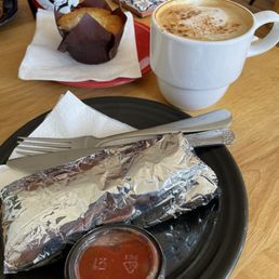 Breakfast burrito, coffee, and a muffin Breakfast burrito, coffee, and a muffin