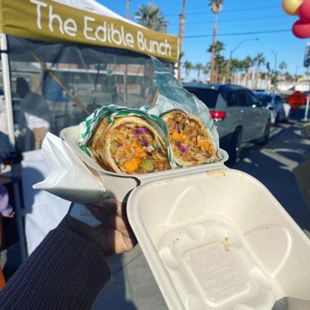 The Edible Bunch - a person holding a sandwich in a styrofoam container - Vegan Near Me The Edible Bunch - a person holding a sandwich in a styrofoam container - Vegan Near Me